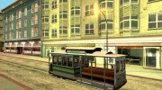 The tram is white with bright green stripes  миниатюра 4