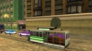 The tram is white with bright green stripes  миниатюра 2