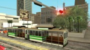 The tram is white with bright green stripes  миниатюра 6