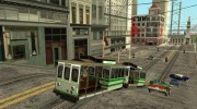 The tram is white with bright green stripes  миниатюра 5