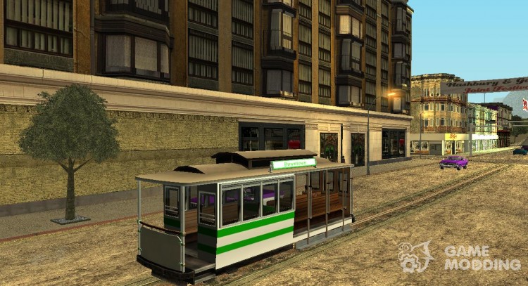 The tram is white with bright green stripes